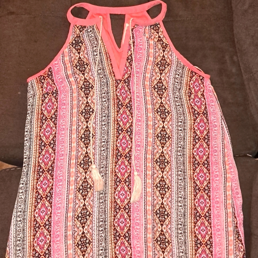 Pink Bohemian style dress with tassels in the front.